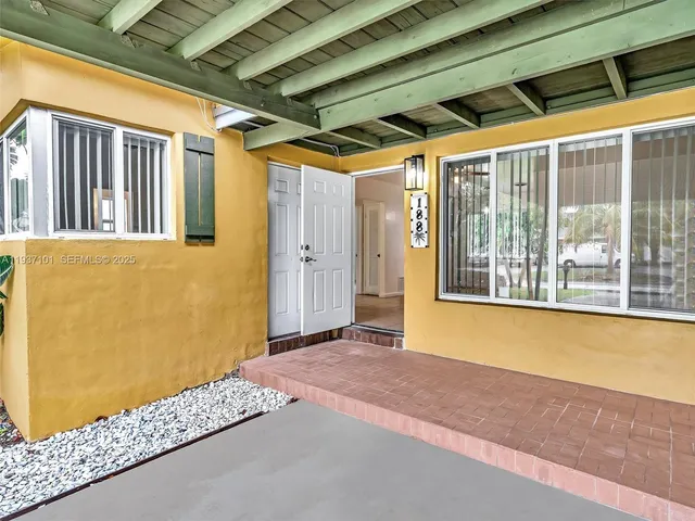 a bathroom with a shower a toilet and a sink