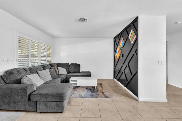 a living room with furniture and a couch