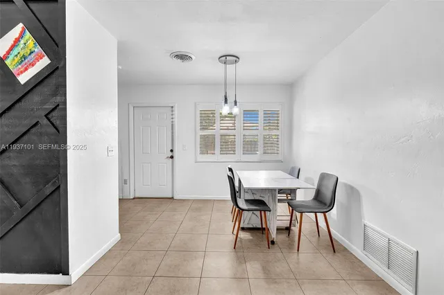 a kitchen with stainless steel appliances granite countertop a refrigerator sink and cabinets