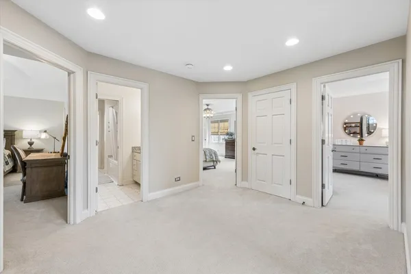 a bathroom with a glass shower door and a mirror