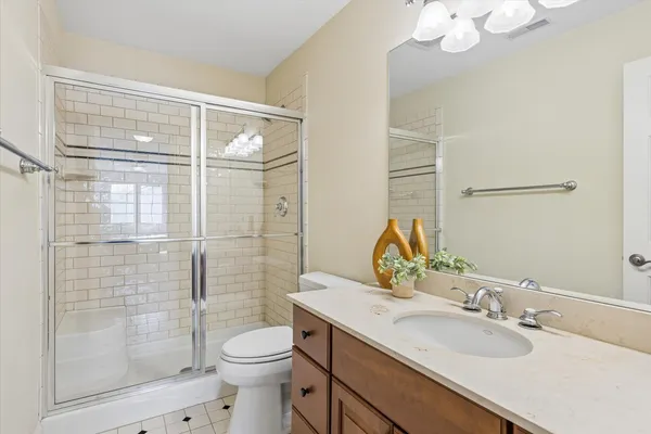 a front view of house with yard and trees in the background