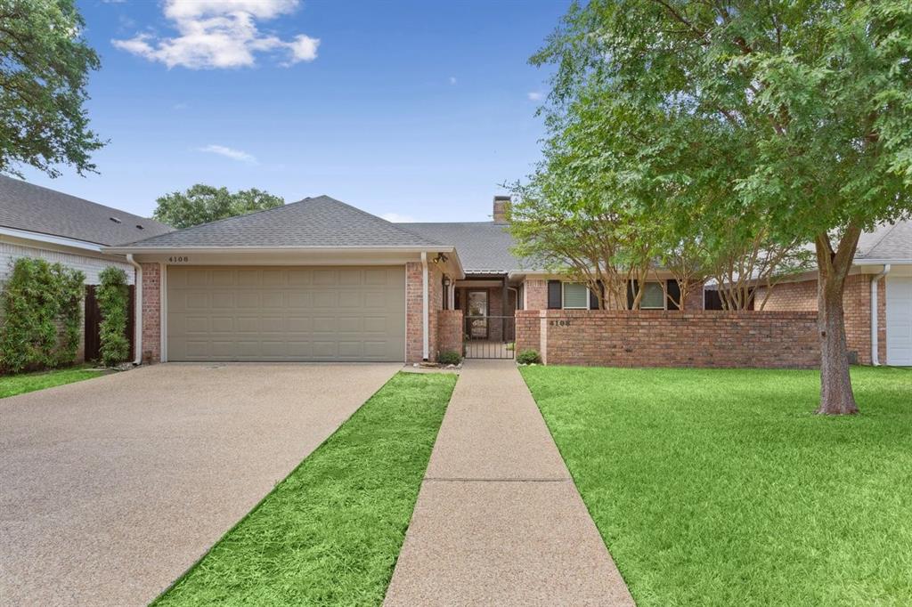 4108 Old Mill Road Waco, TX 76710 - Photo 39 of 40 Brick exterior with a peaked roof, featuring an attached garage and a gated courtyard