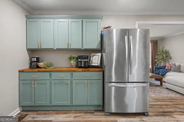 a kitchen with a refrigerator and a cabinets