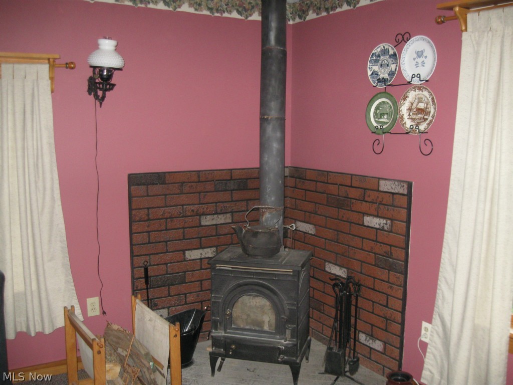 3963 State Road Medina, OH 44256 - Photo 7 of 25 Wood stove in family room helps to heat the home!