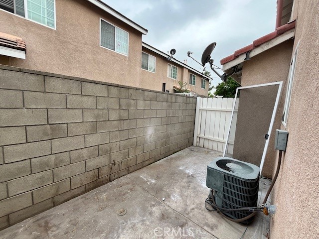1004 South Riverside Avenue, Unit B2 Rialto, CA 92376 - Photo 3 of 14 a view of a porch with wooden floor and fence