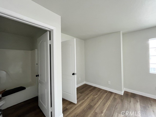 1004 South Riverside Avenue, Unit B2 Rialto, CA 92376 - Photo 5 of 14 a view of a hallway with wooden floor and closet area