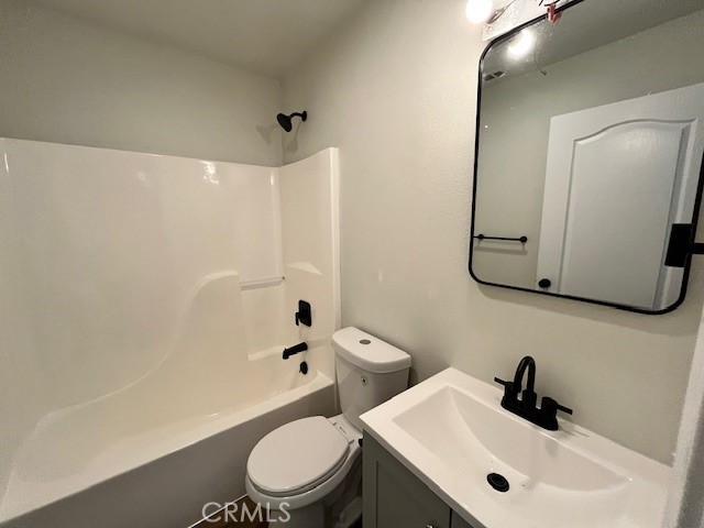 1004 South Riverside Avenue, Unit B2 Rialto, CA 92376 - Photo 7 of 14 a bathroom with a sink a toilet and shower
