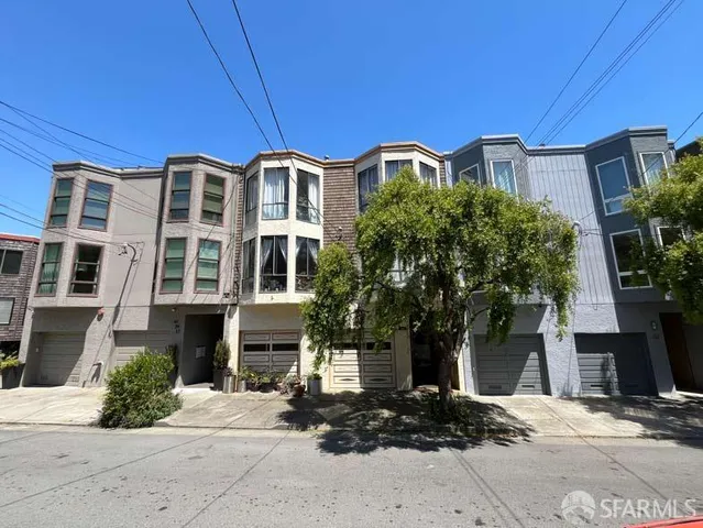 a front view of a building with street view