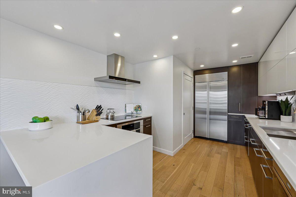 5600 Wisconsin Avenue, Unit 705 Chevy Chase, MD 20815 - Photo 13 of 62 a kitchen with a sink a stove and refrigerator