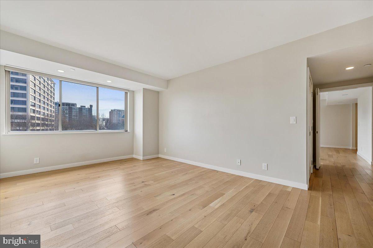 5600 Wisconsin Avenue, Unit 705 Chevy Chase, MD 20815 - Photo 23 of 62 wooden floor in an empty room with a window