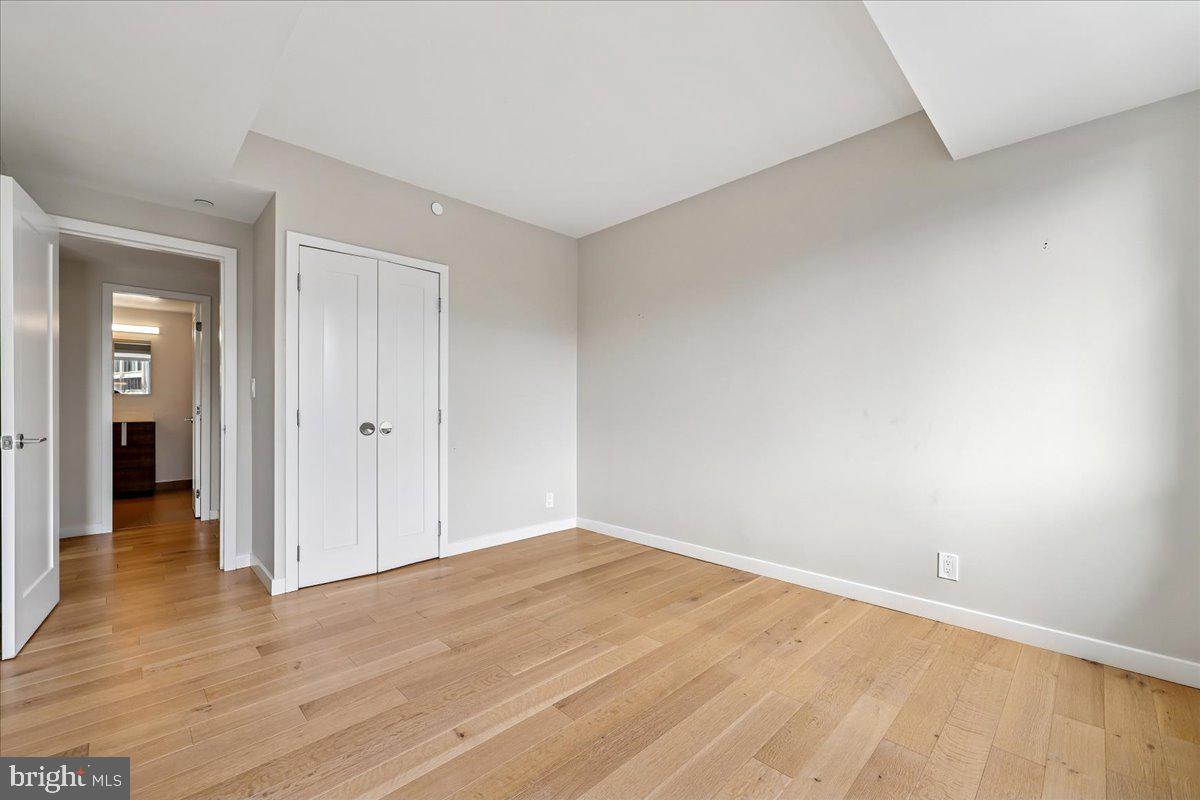5600 Wisconsin Avenue, Unit 705 Chevy Chase, MD 20815 - Photo 31 of 62 a view of an empty room and wooden floor