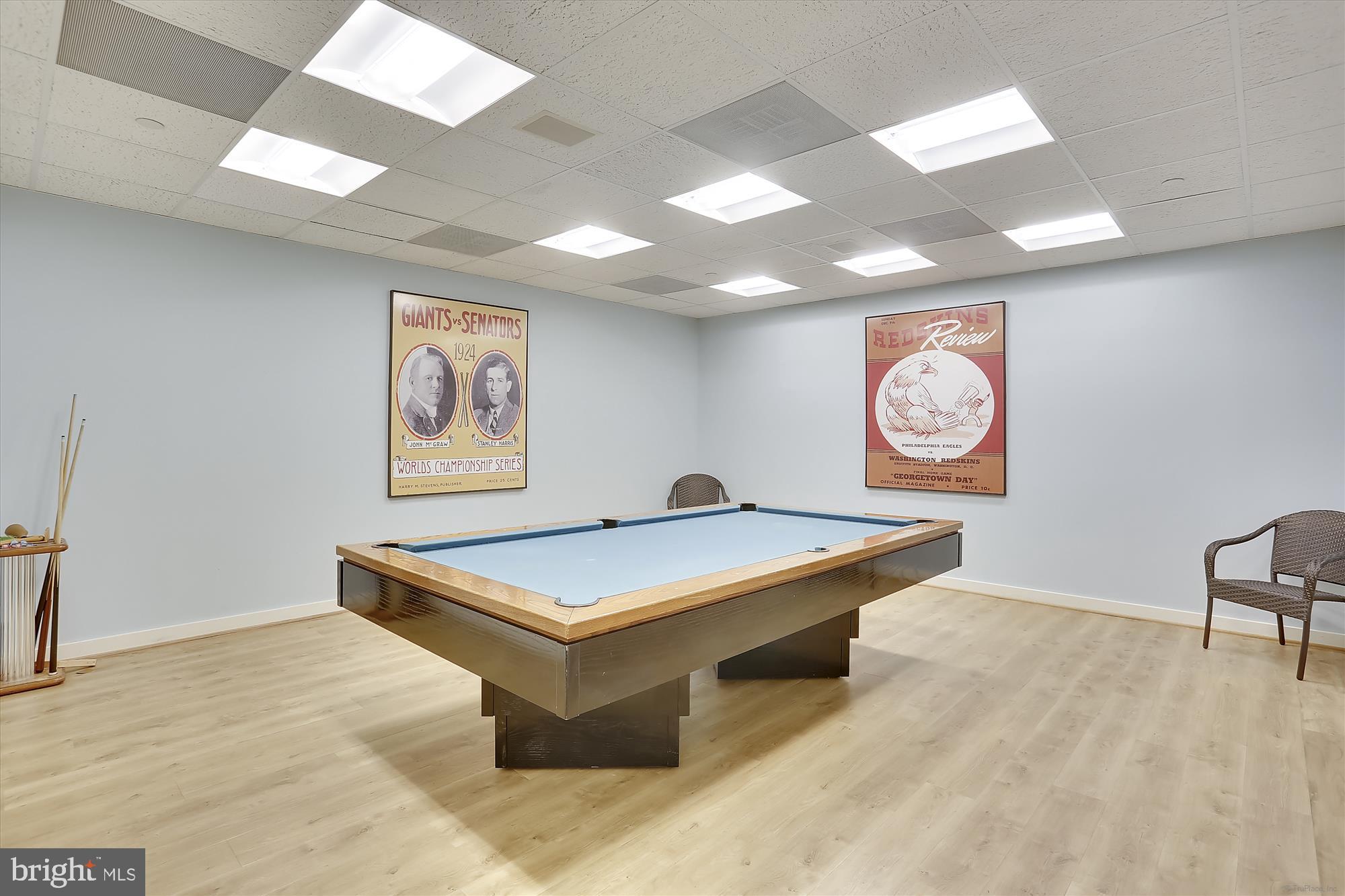 5600 Wisconsin Avenue, Unit 705 Chevy Chase, MD 20815 - Photo 49 of 62 a view of a room with shelves and wooden floor