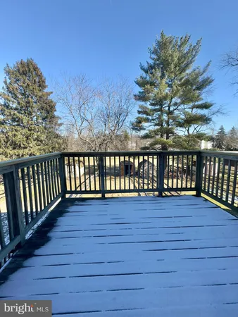 a view of wooden deck and a yard