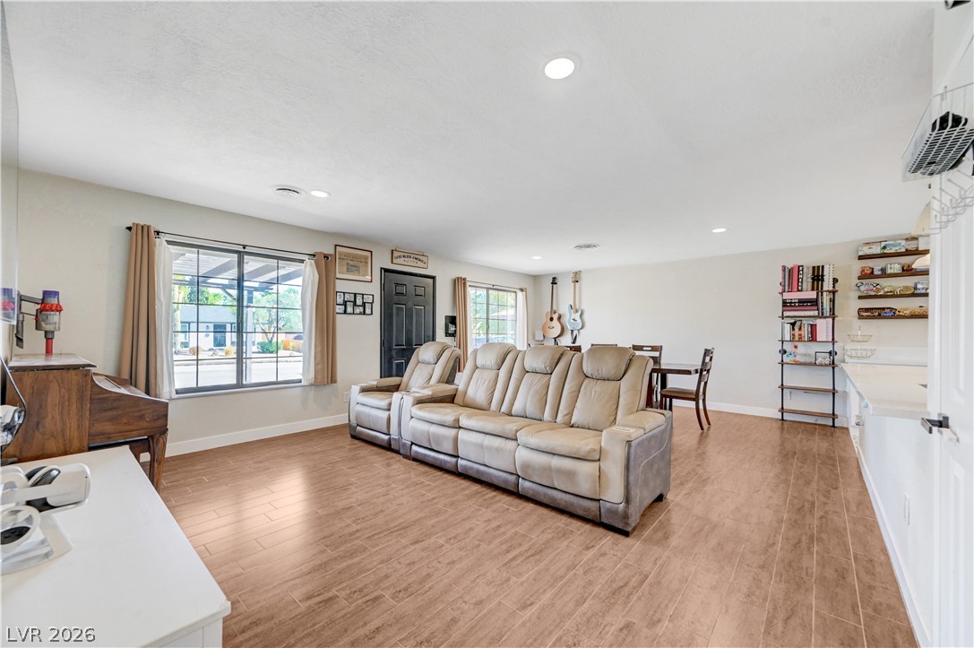 1331 Pinto Road Boulder City, NV 89005 - Photo 13 of 46 A well-lit great room features durable tile flooring and offers ample space for gathering.