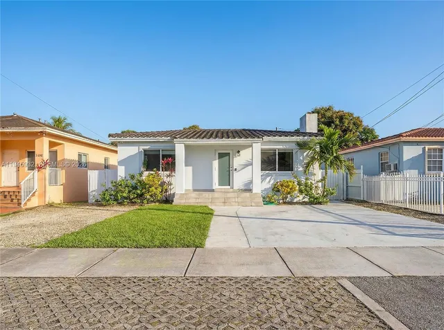 a house view with a garden space