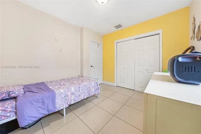 a bedroom with a bed and a cabinets
