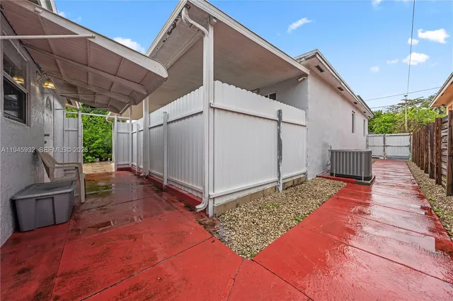 a backyard of a house with seating space