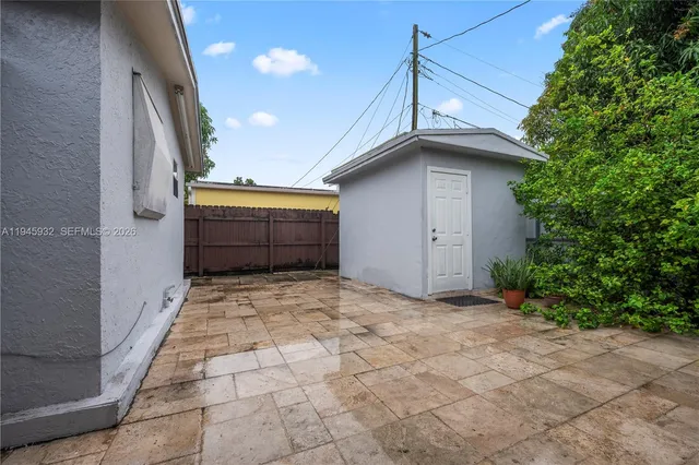 a view of backyard of garage