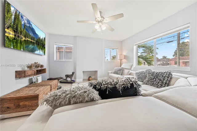a bedroom with a bed couch and window
