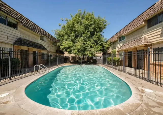 a view of a swimming pool with a patio