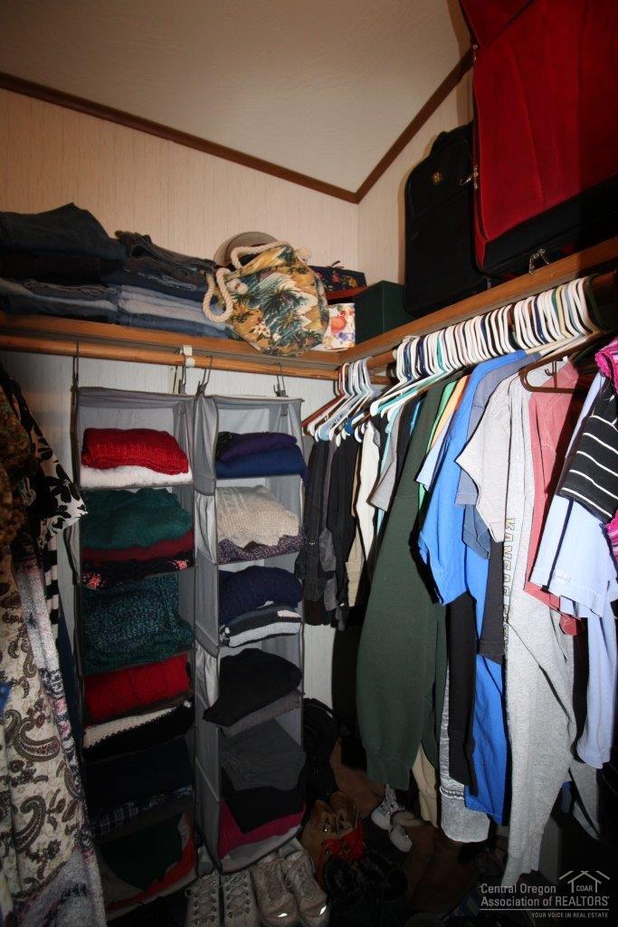 19235 Kiowa Road Bend, OR 97702 - Photo 19 of 25 a view of walk in closet with clothes and shoes