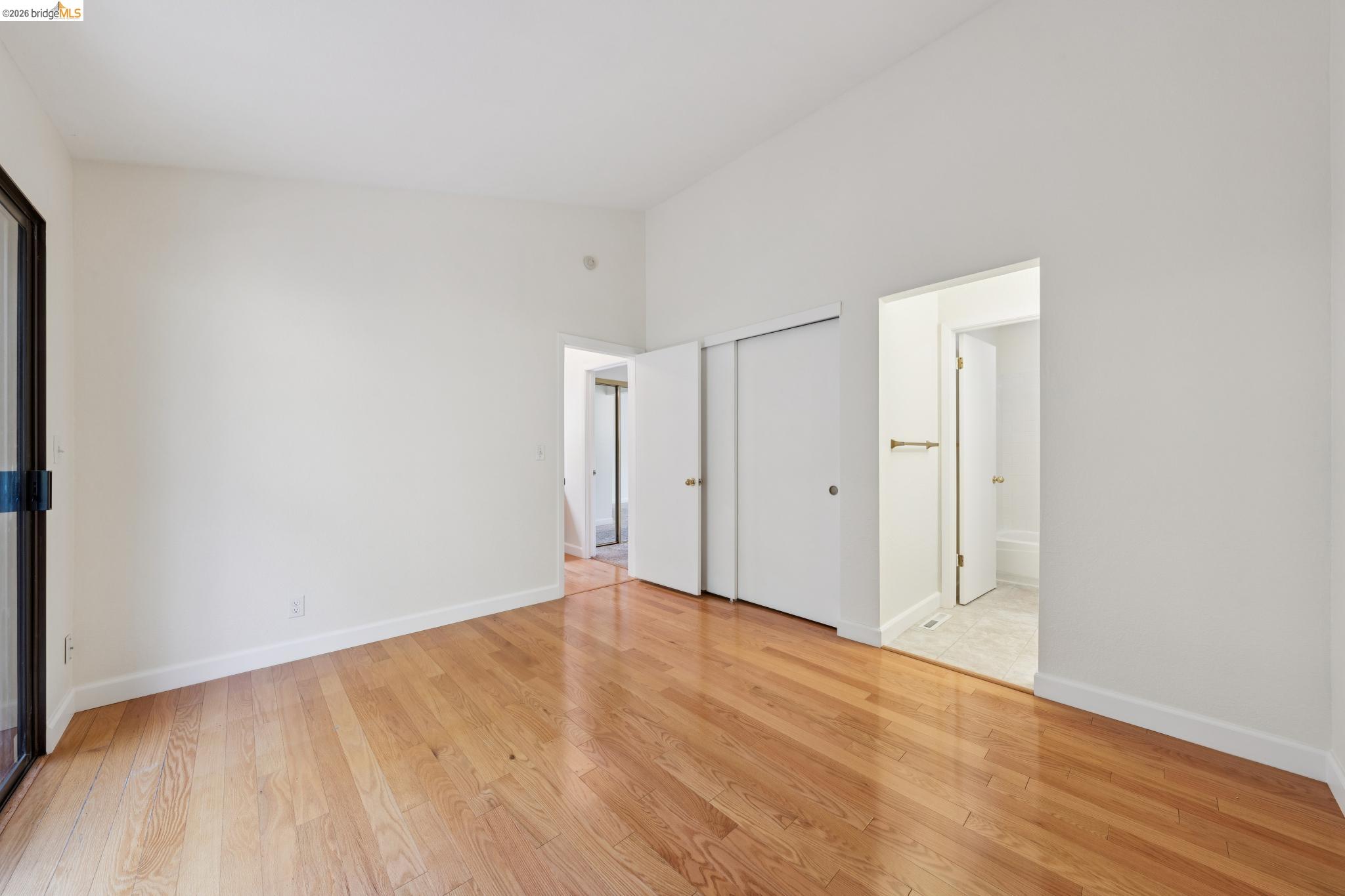261 Redhawk Road Novato, CA 94949 - Photo 26 of 44 Spacious interior room featuring wood-finish flooring, white walls, and high ceilings