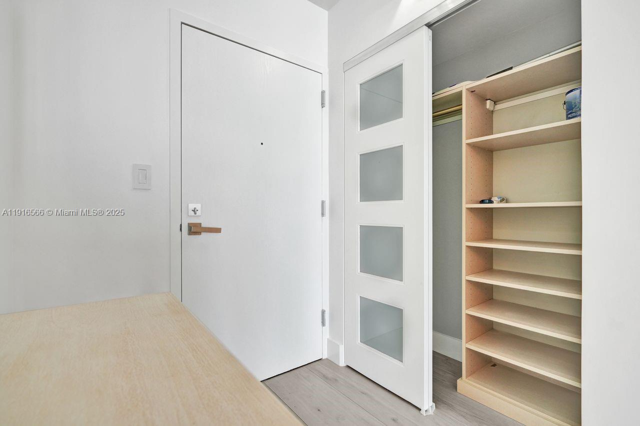 90 Alton Road, Unit 1907 Miami Beach, FL 33139 - Photo 33 of 45 a view of walk in closet with empty racks