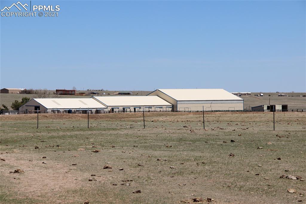 33375 Fogarty Road Calhan, CO 80808 - Photo 2 of 50 a view of a dry yard with wooden fence