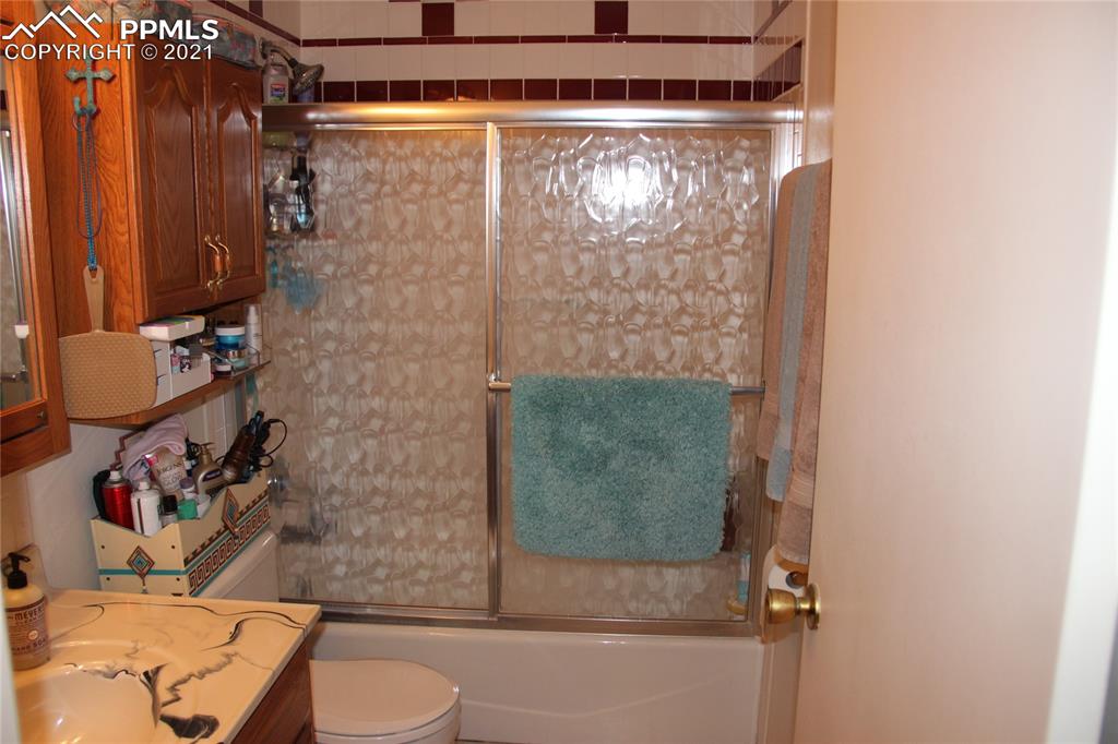 33375 Fogarty Road Calhan, CO 80808 - Photo 13 of 50 a bathroom with a toilet and shower