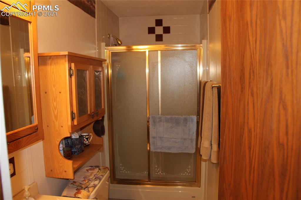 33375 Fogarty Road Calhan, CO 80808 - Photo 21 of 50 a bathroom with a mirror