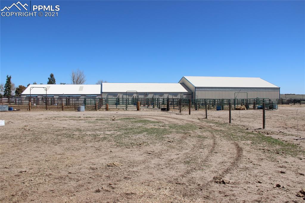 33375 Fogarty Road Calhan, CO 80808 - Photo 33 of 50 a backyard of a house with table and chairs