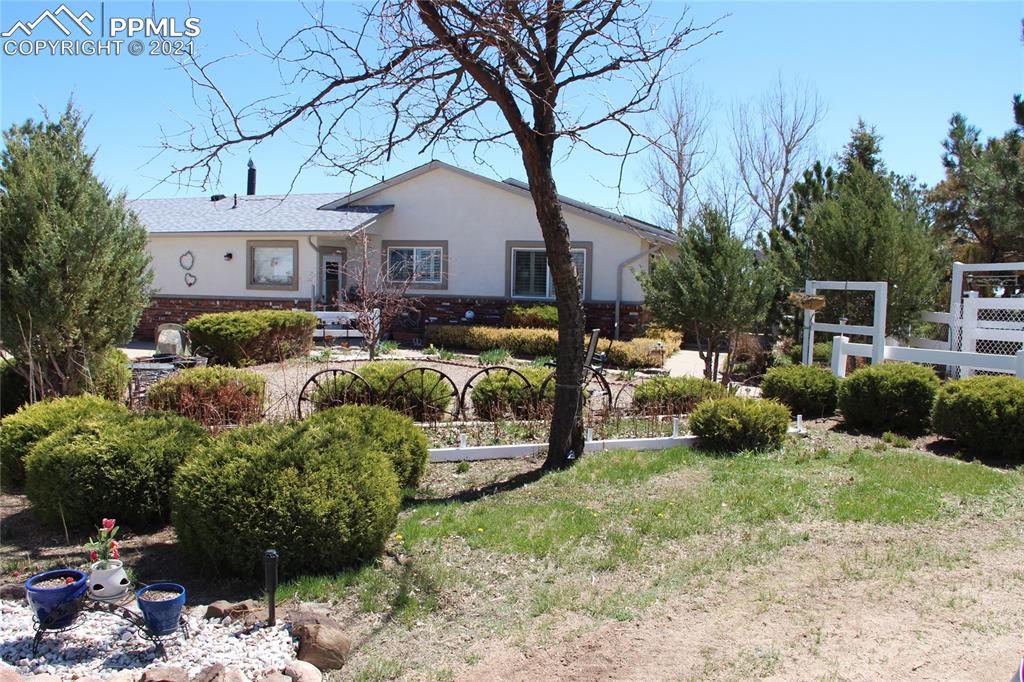 33375 Fogarty Road Calhan, CO 80808 - Photo 42 of 50 a view of a house with backyard sitting area and garden