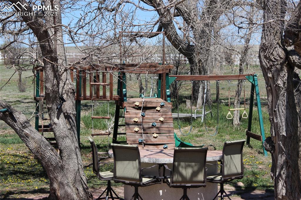 33375 Fogarty Road Calhan, CO 80808 - Photo 43 of 50 a view of a chairs and table in the patio