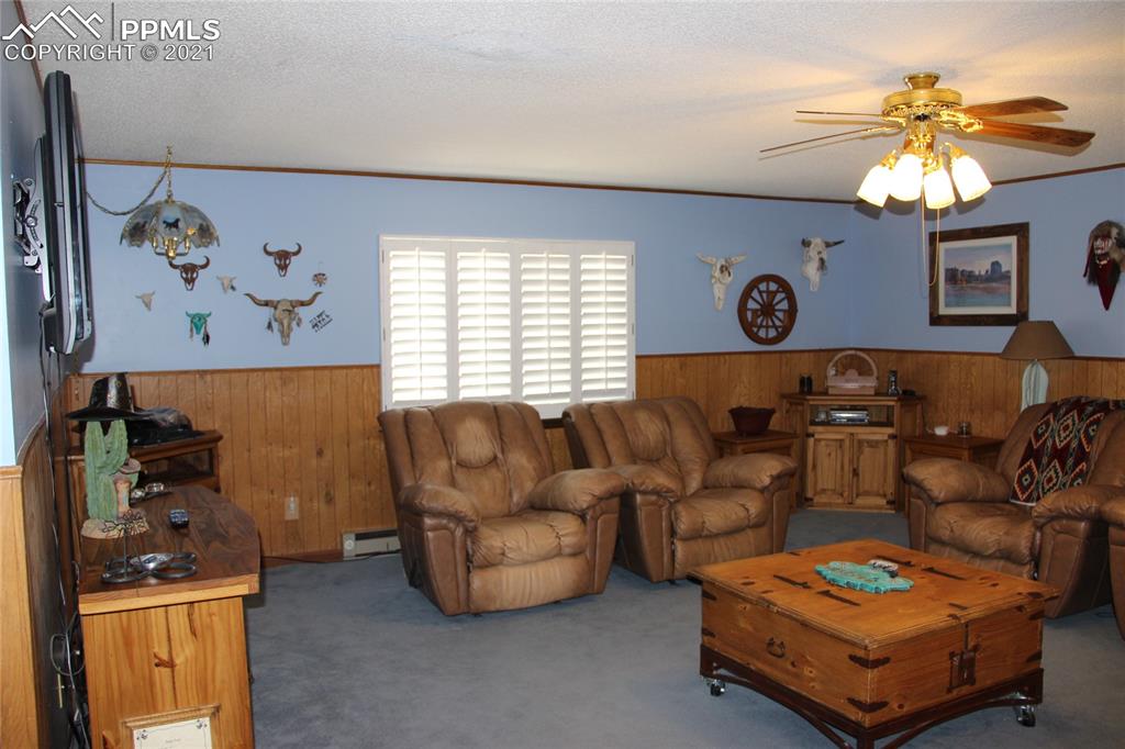 33375 Fogarty Road Calhan, CO 80808 - Photo 9 of 50 a living room with furniture and a window