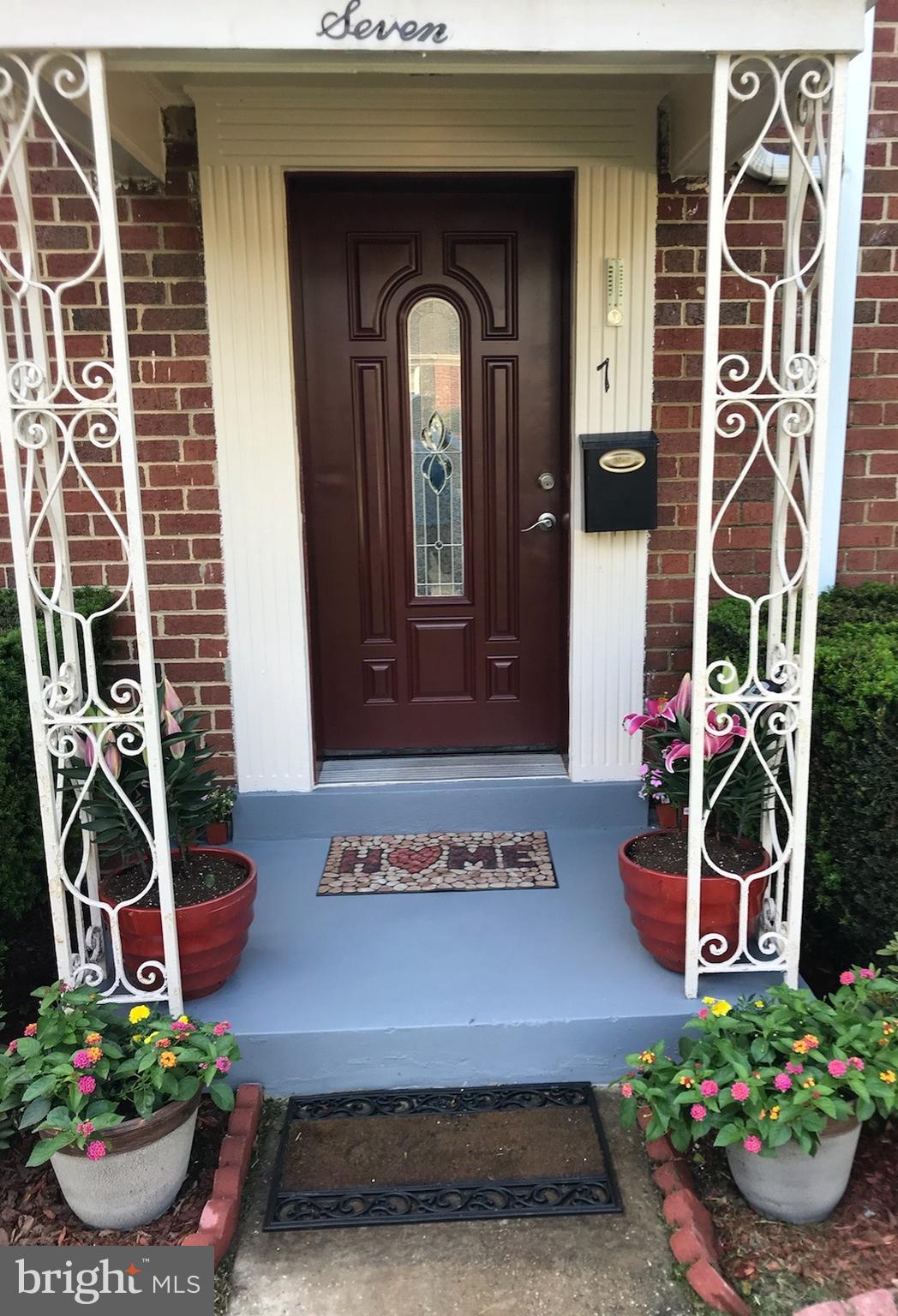 7 Oldham Road Silver Spring, MD 20901 - Photo 22 of 32 a front view of a house with a garden