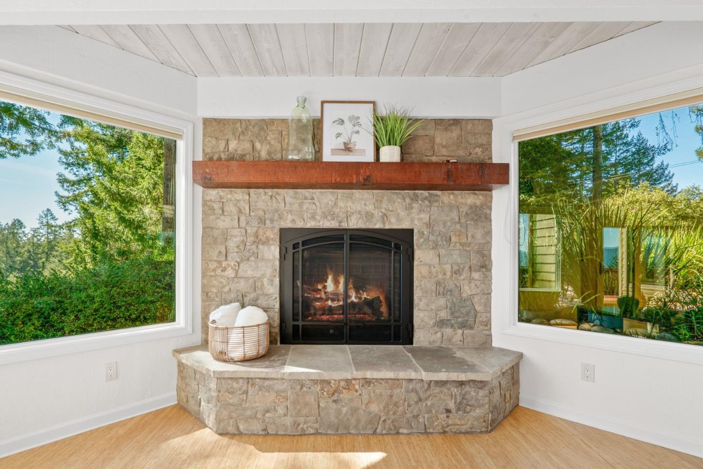 480 Quail Ridge Road Scotts Valley, CA 95066 - Photo 14 of 69 a living room with a fireplace and large windows