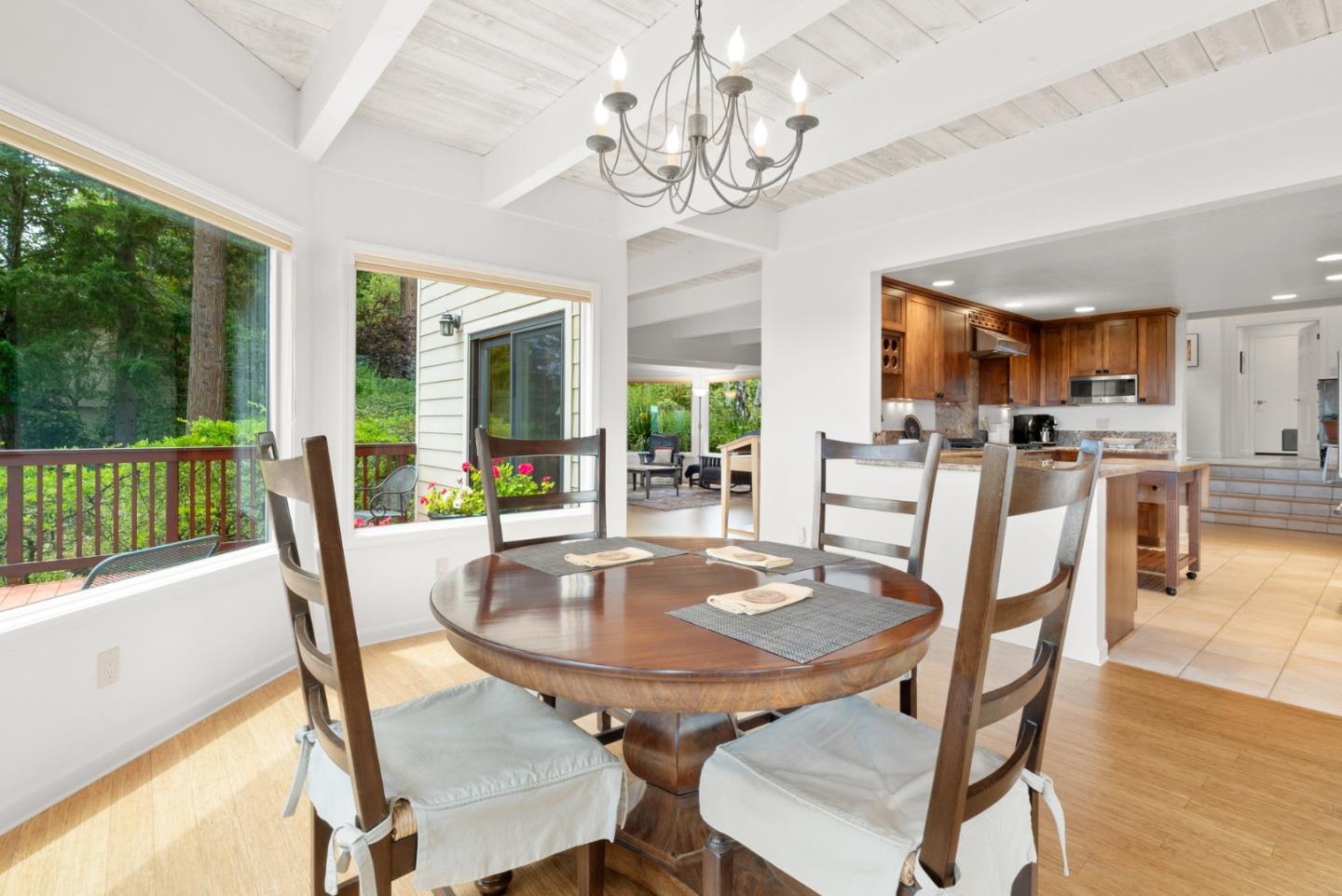 480 Quail Ridge Road Scotts Valley, CA 95066 - Photo 15 of 68 a dining room with furniture a chandelier and wooden floor