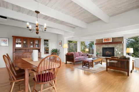 a kitchen with stainless steel appliances granite countertop a refrigerator and a stove