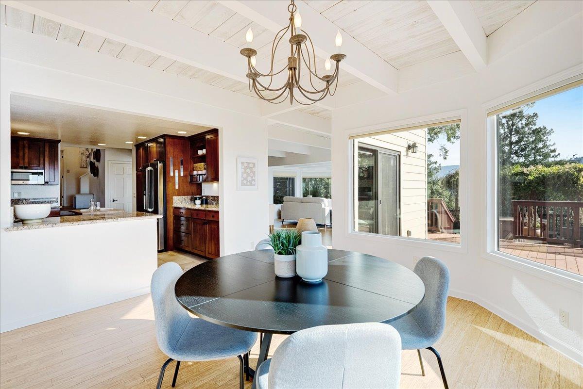 480 Quail Ridge Road Scotts Valley, CA 95066 - Photo 19 of 69 a dining room with furniture a chandelier and wooden floor