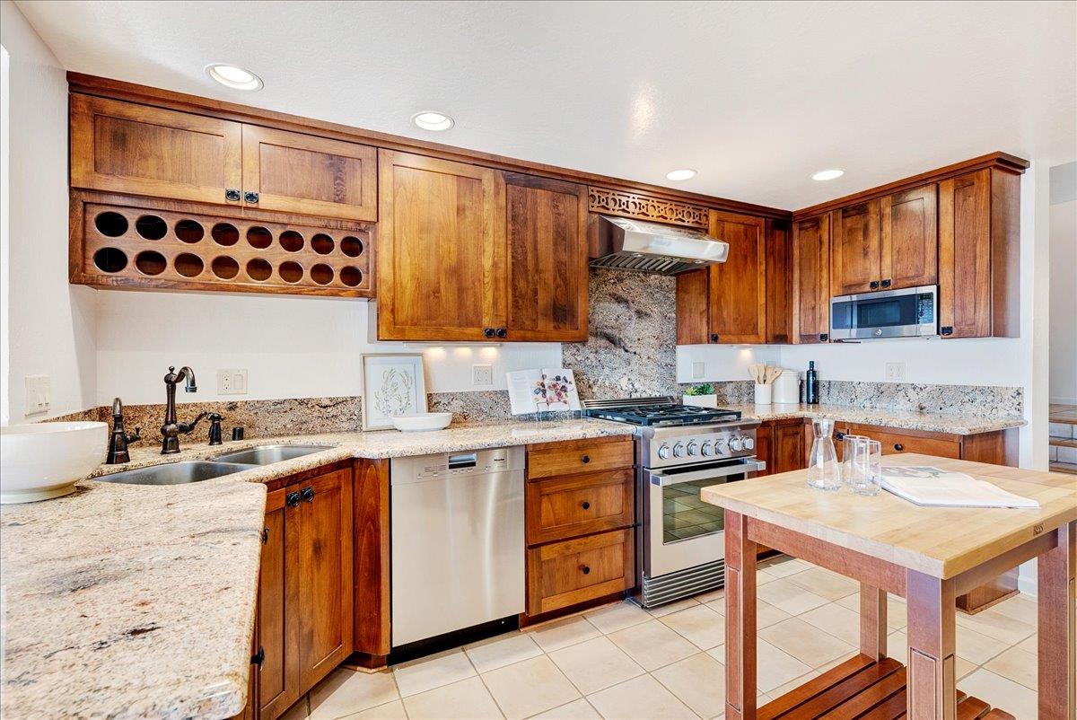 480 Quail Ridge Road Scotts Valley, CA 95066 - Photo 20 of 69 a kitchen with a stove a sink a refrigerator and cabinets