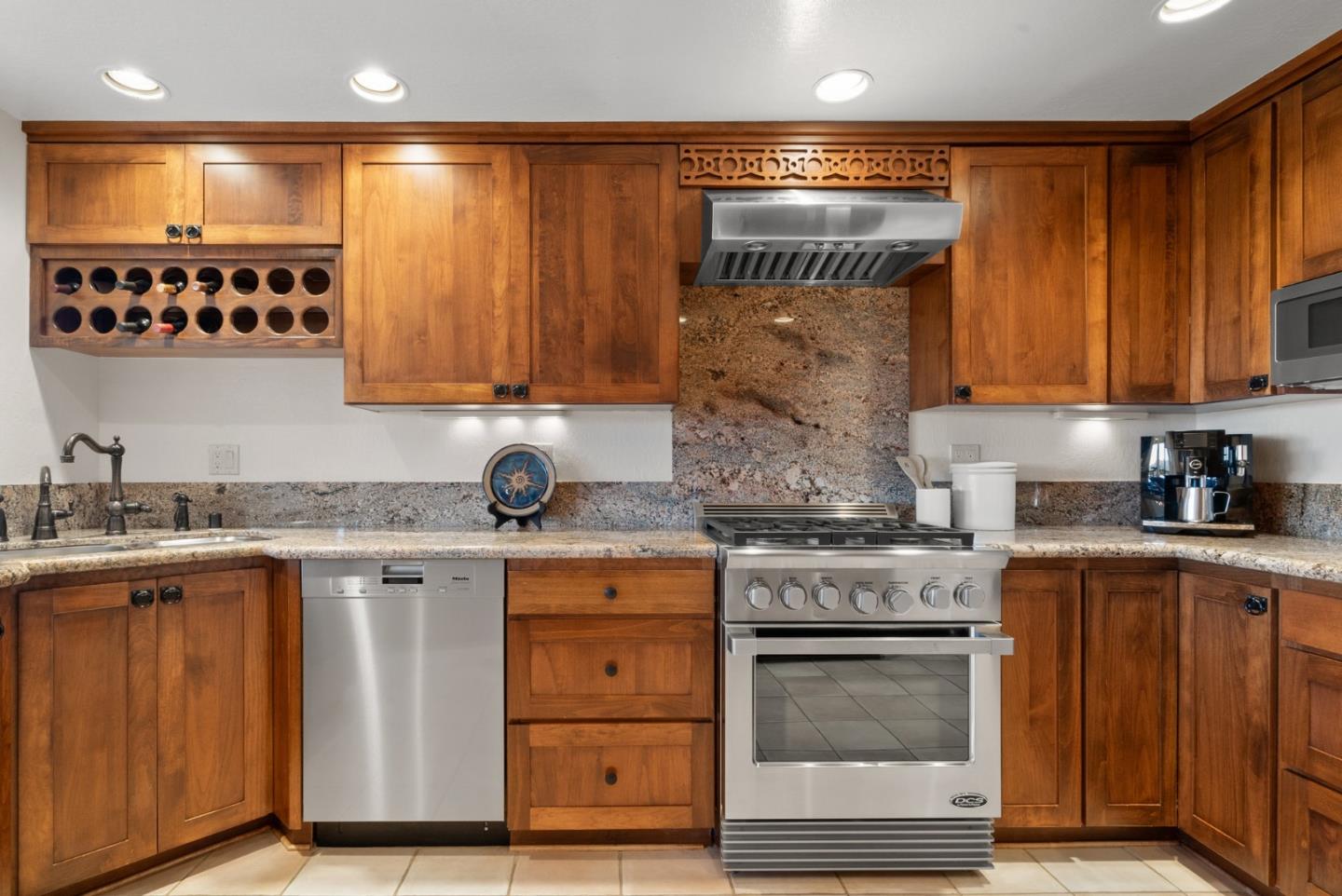 480 Quail Ridge Road Scotts Valley, CA 95066 - Photo 23 of 68 a kitchen with granite countertop a stove and cabinets