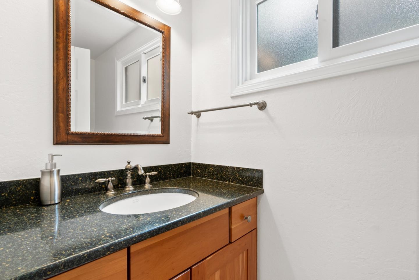 480 Quail Ridge Road Scotts Valley, CA 95066 - Photo 26 of 68 a bathroom with sink and mirror