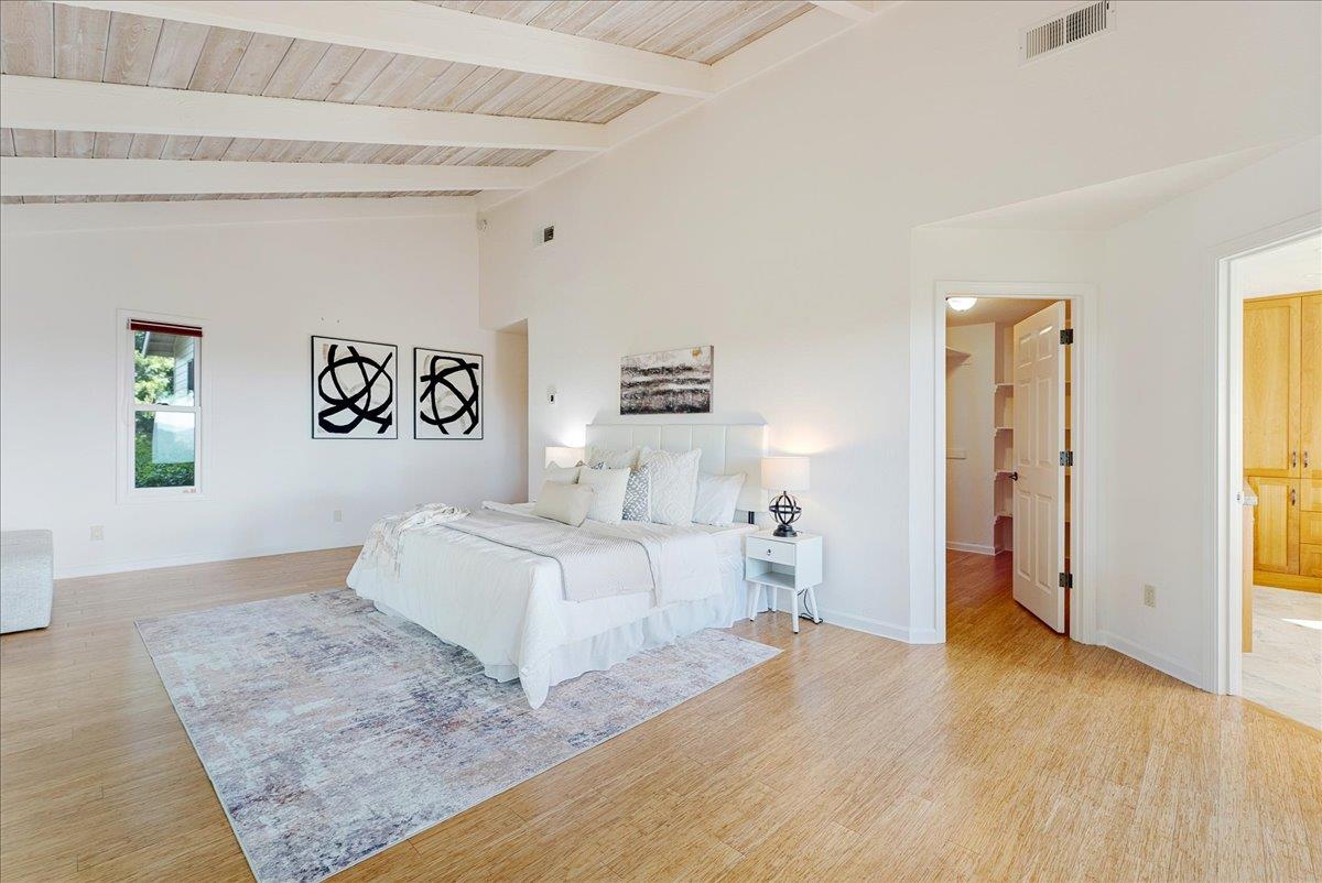 480 Quail Ridge Road Scotts Valley, CA 95066 - Photo 31 of 69 a spacious bedroom with a bed and a couch