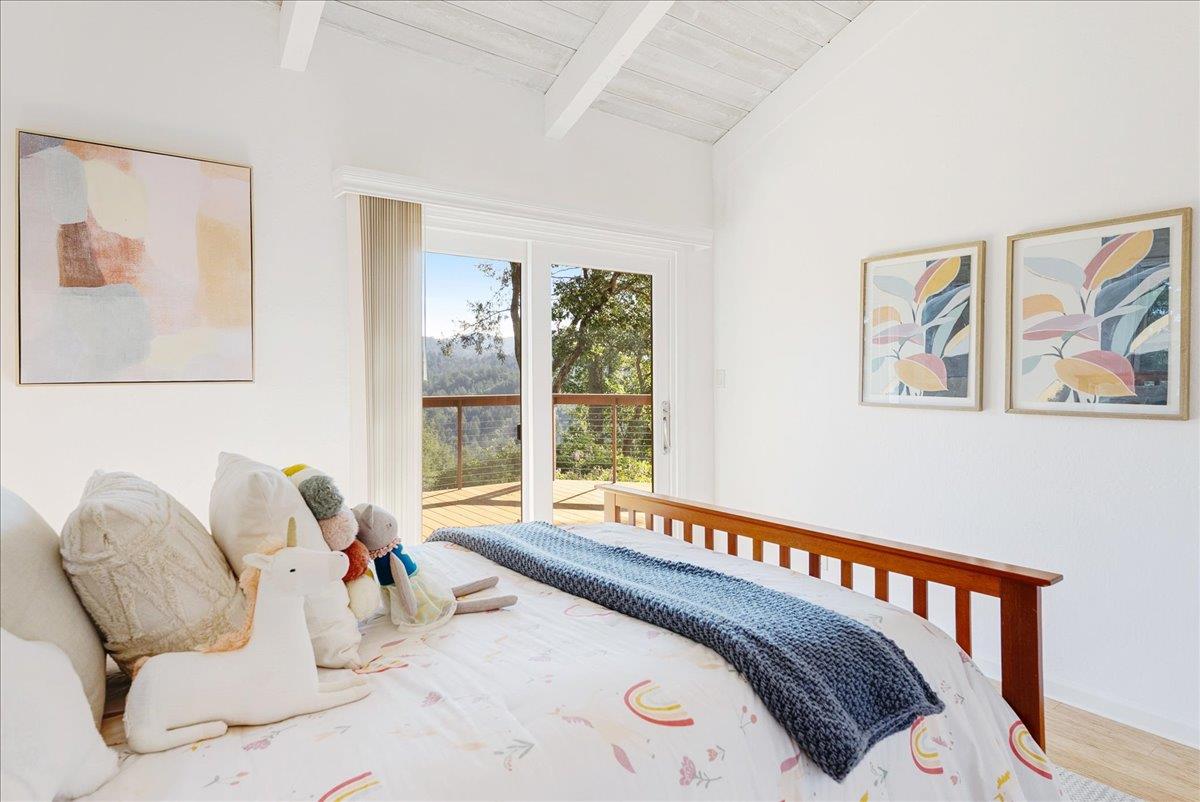 480 Quail Ridge Road Scotts Valley, CA 95066 - Photo 40 of 69 a bedroom with furniture and a large window