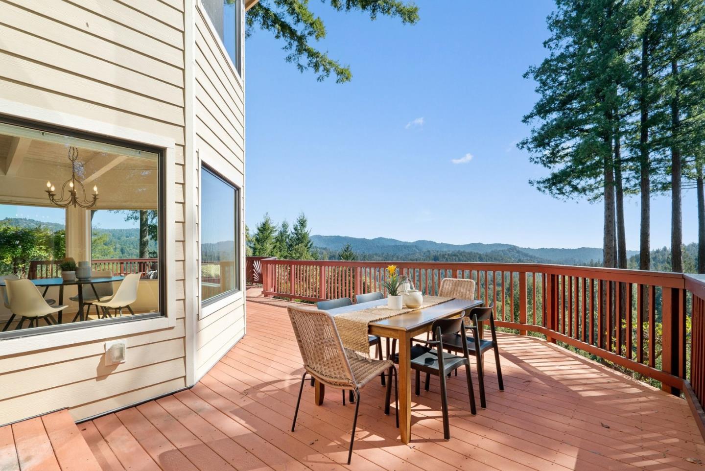 480 Quail Ridge Road Scotts Valley, CA 95066 - Photo 46 of 69 a view of a chairs and table on the wooden deck