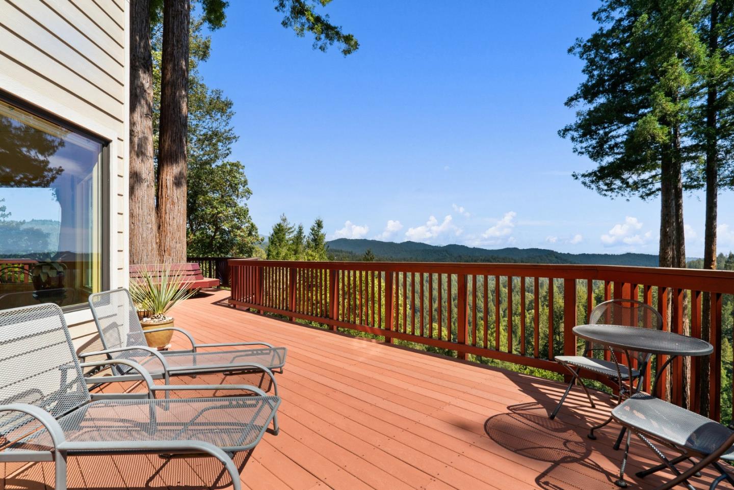 480 Quail Ridge Road Scotts Valley, CA 95066 - Photo 47 of 68 a balcony with wooden floor table and chairs