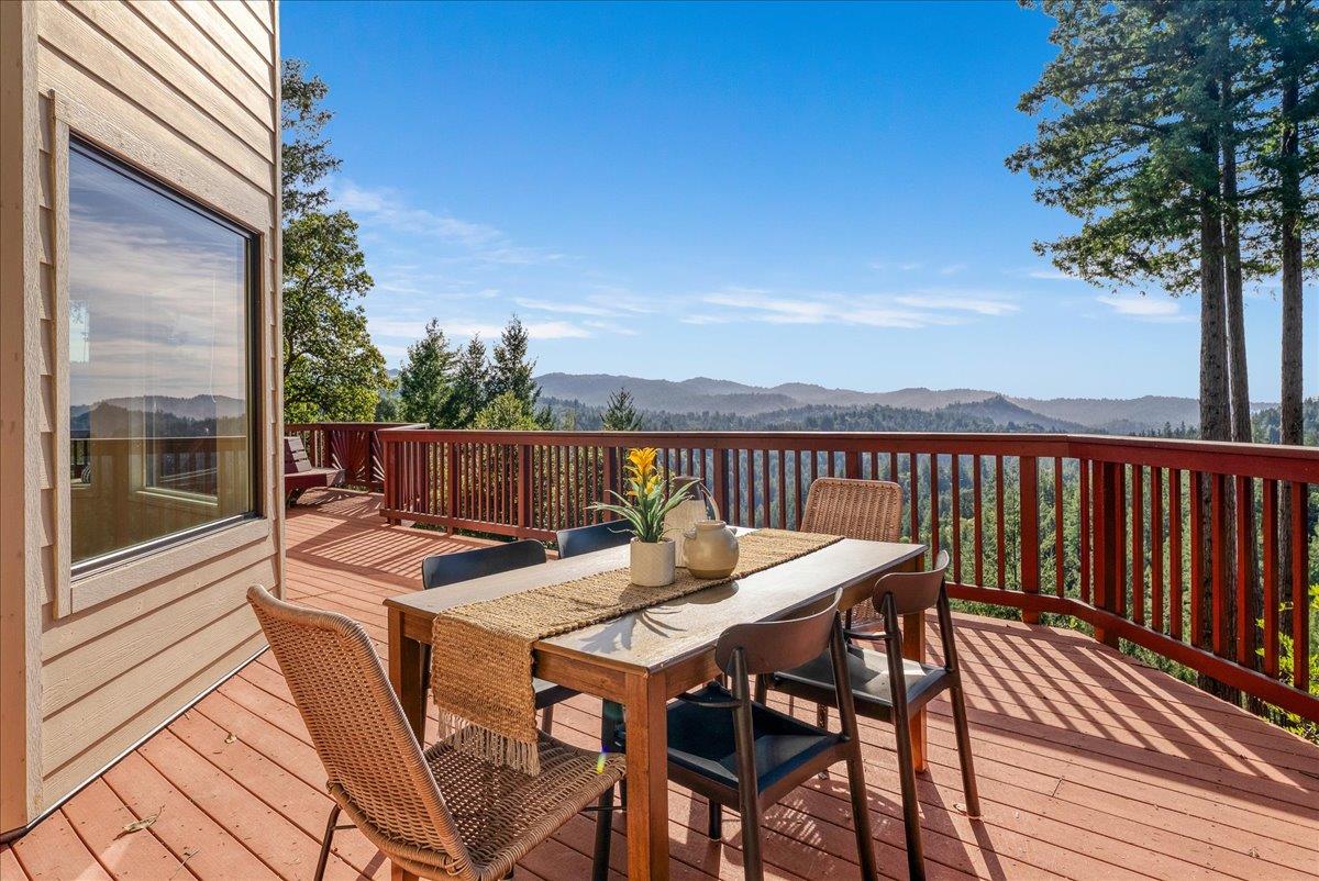 480 Quail Ridge Road Scotts Valley, CA 95066 - Photo 47 of 69 a patio with wooden floor a yard a table and chairs
