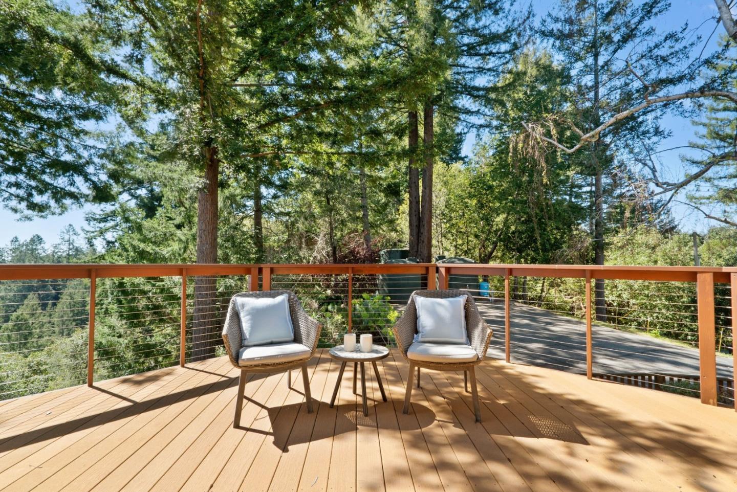 480 Quail Ridge Road Scotts Valley, CA 95066 - Photo 54 of 69 a view of a chairs and table on the wooden deck