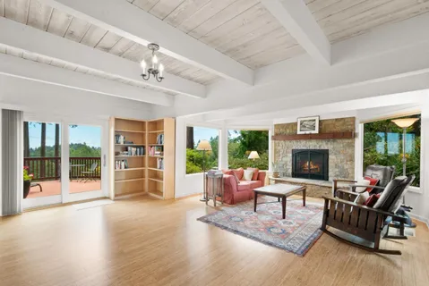 a view of interior space with wooden floor and windows