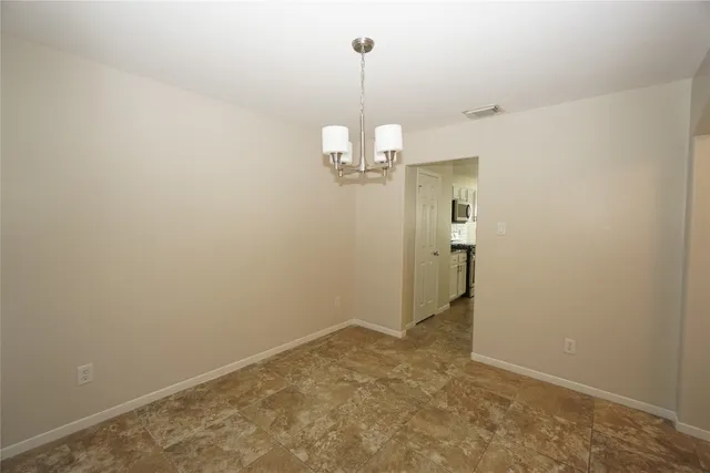 a view of a chandelier in an empty room
